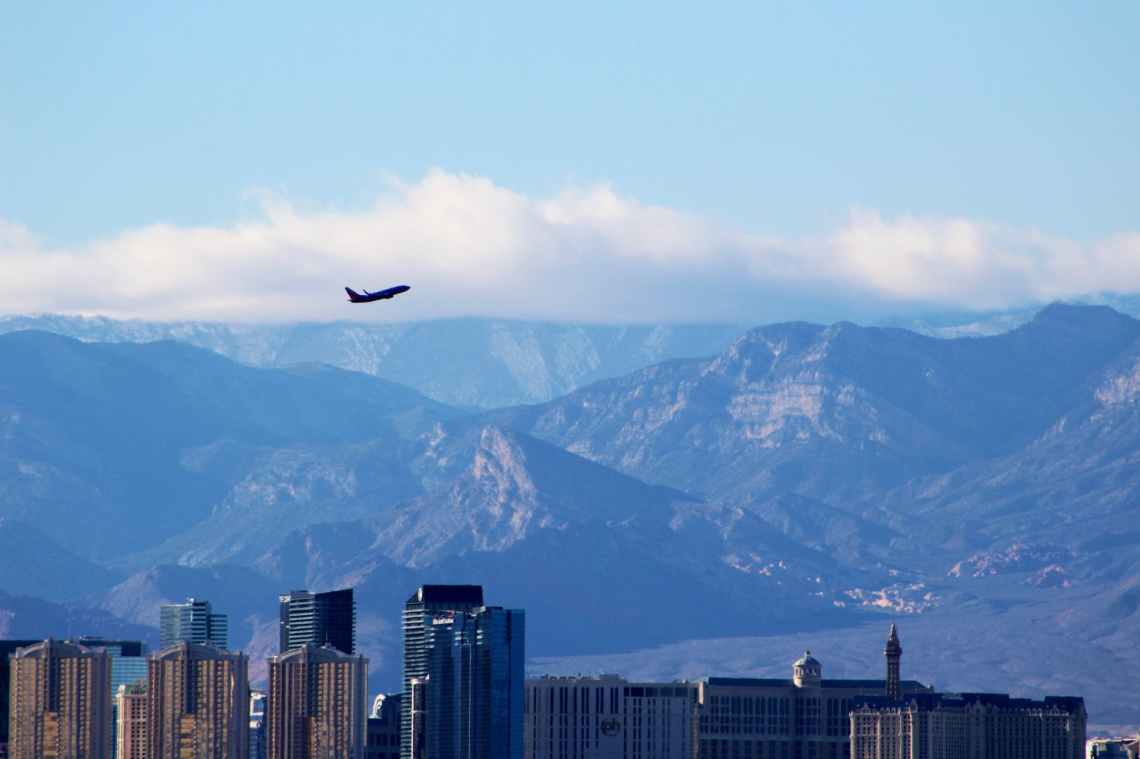 airplane architecture buildings clouds